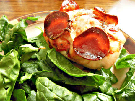 Pizza Stuffed Chicken Breasts // Budget Girl --- This chicken gives you the taste of pizza without all the added calories! Nutritional Info: 180 Calories, 5 g fat, 5 g carbs, 1 g fiber, 3 g sugar, 30 g protein #chicken #pizza #healthy #stuffed #cooking #recipes