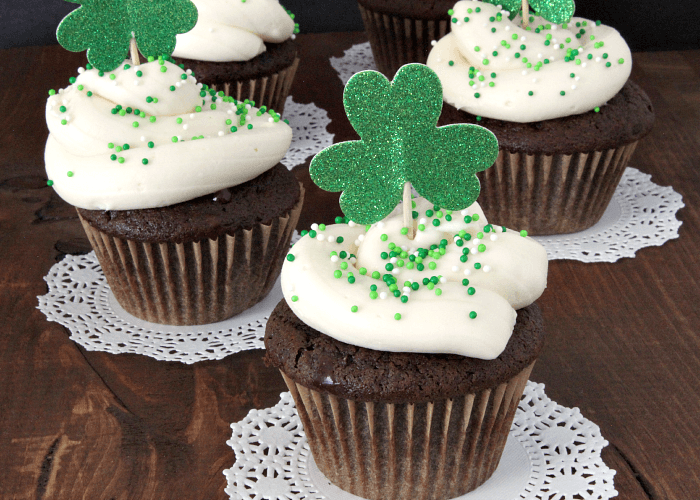 Irish Car Bomb Cupcakes take a popular St. Patrick's Day drink and turn it into an amazing dessert. Rich chocolate cupcake filled with gooey, dark chocolate ganache, and topped with Irish cream cheese frosting. Nothing will impress your guests more this holiday! || via growingupgabel.com #irish #cupcakes #stpatricksday