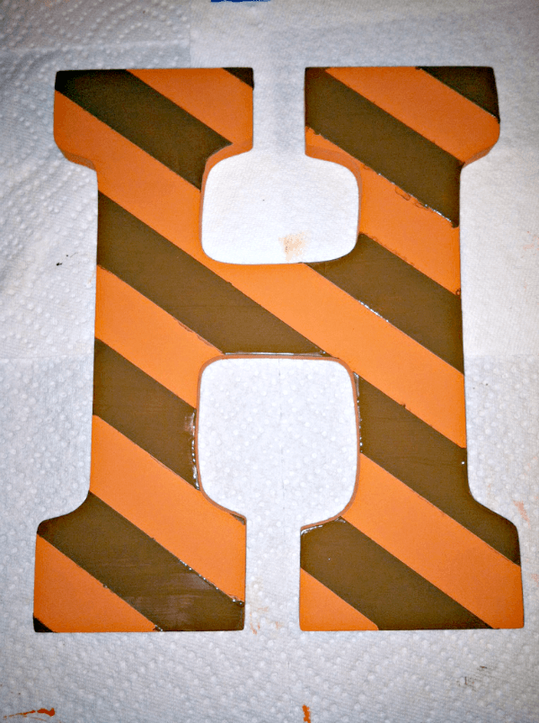 Hand-Painted Letter --- Easy, budget-friendly craft and makes a great substitute for a wreath. || via diybudgetgirl.com #letter #diy #crafts #paint #stripes 