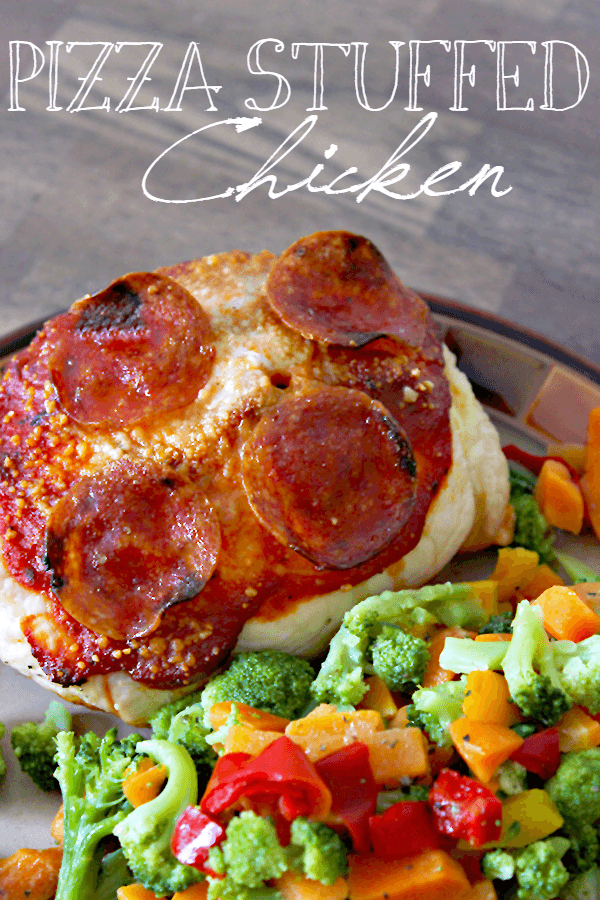 Pizza stuffed chicken gives you the taste of pizza without all the added calories! Only 180 calories per serving, high in protein and, of course, amazing. This healthy dish is a family-favorite. Customize it by adding your favorite pizza toppings! Nutritional Info: 180 Calories, 5 g fat, 5 g carbs, 1 g fiber, 3 g sugar, 30 g protein || via diybudgetgirl.com #chicken #pizza #healthy #stuffed #cooking #recipes