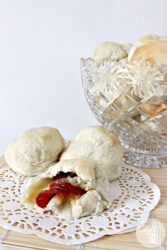Homemade Appalachian Pepperoni Rolls --- Balls of soft, doughy, pepperoni & cheesy goodness. A great party food, definitely a crowd pleaser. Also easy to make! If you only learn one thing about Appalachia, it's that we invented the pepperoni roll. You're welcome, Earth. || via diybudgetgirl.com #westvirginia #appalachia #pepperoni #rolls #west #virginia #food #recipes #baking