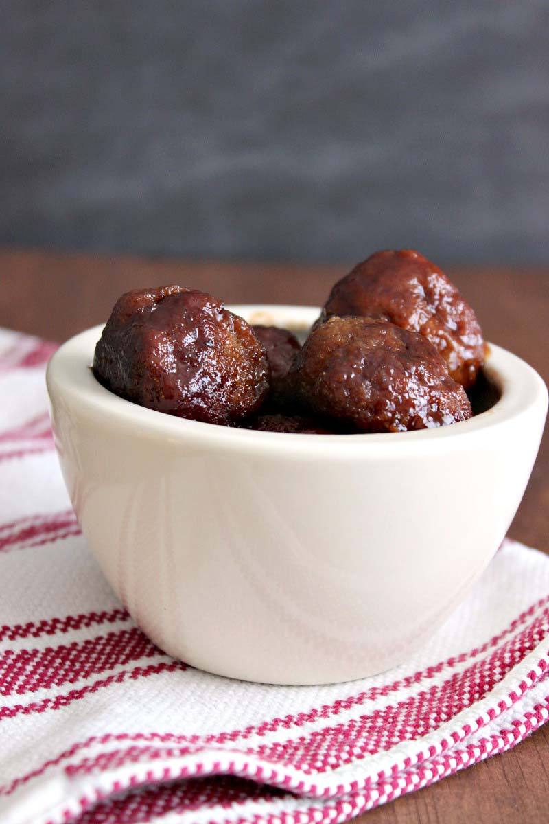 Slow Cooker Sriracha Meatballs --- Three ingredients, one amazing recipe! Sriracha meatballs are a quick and easy crock pot recipe. These are easy to make and a HUGE hit at parties.