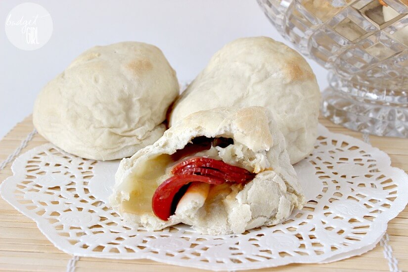 Homemade Appalachian Pepperoni Rolls --- Balls of soft, doughy, pepperoni & cheesy goodness. A great party food, definitely a crowd pleaser. Also easy to make! If you only learn one thing about Appalachia, it's that we invented the pepperoni roll. You're welcome, Earth. || via diybudgetgirl.com #westvirginia #appalachia #pepperoni #rolls #west #virginia #food #recipes #baking