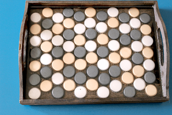 Bottle Cap Tray // Budget Girl --- This is a really cool project, but it's easy to screw up. So here's a tutorial for how to make one, as well as a list of tips to keep you from making the same mistakes I made. #crafts #diy #bottlecaps #tray #decor 