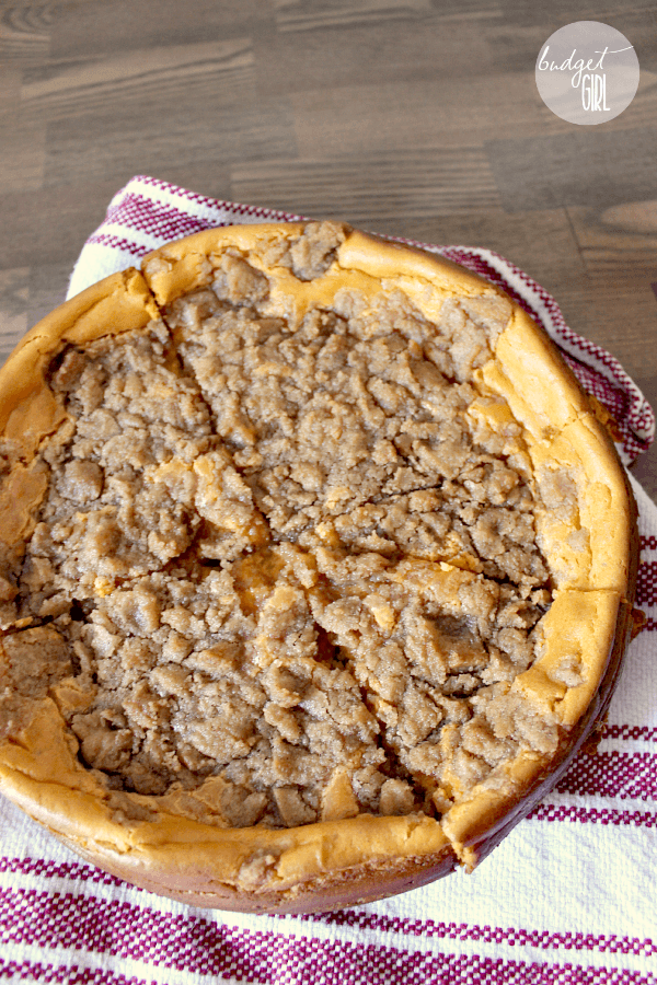 Pumpkin Cheesecake with Brown Sugar Cinnamon Streusel --- This pumpkin cheesecake is delicious! The light taste of the pumpkin, the sweetness of the streusel, soft and crunchy together. And way easier than a pie. :P || via diybudgetgirl.com #pumpkin #cheesecake #desserts #13daysofpumpkin #autumn #fall #food #recipes