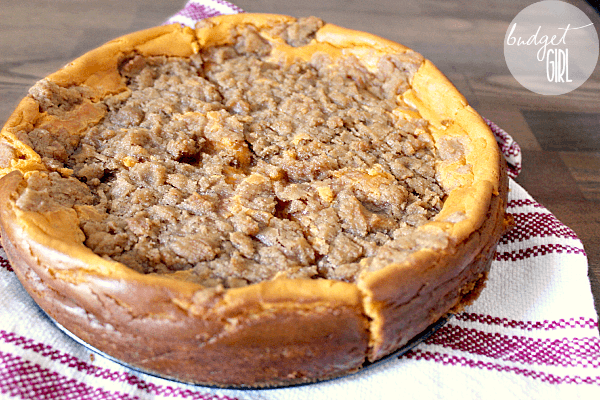 Pumpkin Cheesecake with Brown Sugar Cinnamon Streusel --- This pumpkin cheesecake is delicious! The light taste of the pumpkin, the sweetness of the streusel, soft and crunchy together. And way easier than a pie. :P || via diybudgetgirl.com #pumpkin #cheesecake #desserts #13daysofpumpkin #autumn #fall #food #recipes