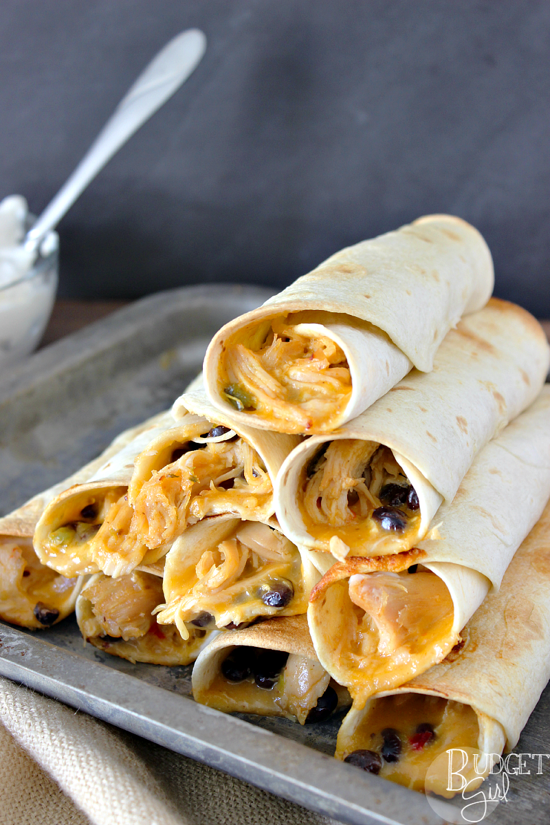 Slow cooker chicken nacho taquitos are very easy to make and healthier than regular taquitos because they're baked, not fried. || via diybudgetgirl.com #taquitos #mexican #food #recipes #slowcooker #crockpot #onepot #familyfavorite #easy #bake #baked #notfried #nacho #chicken