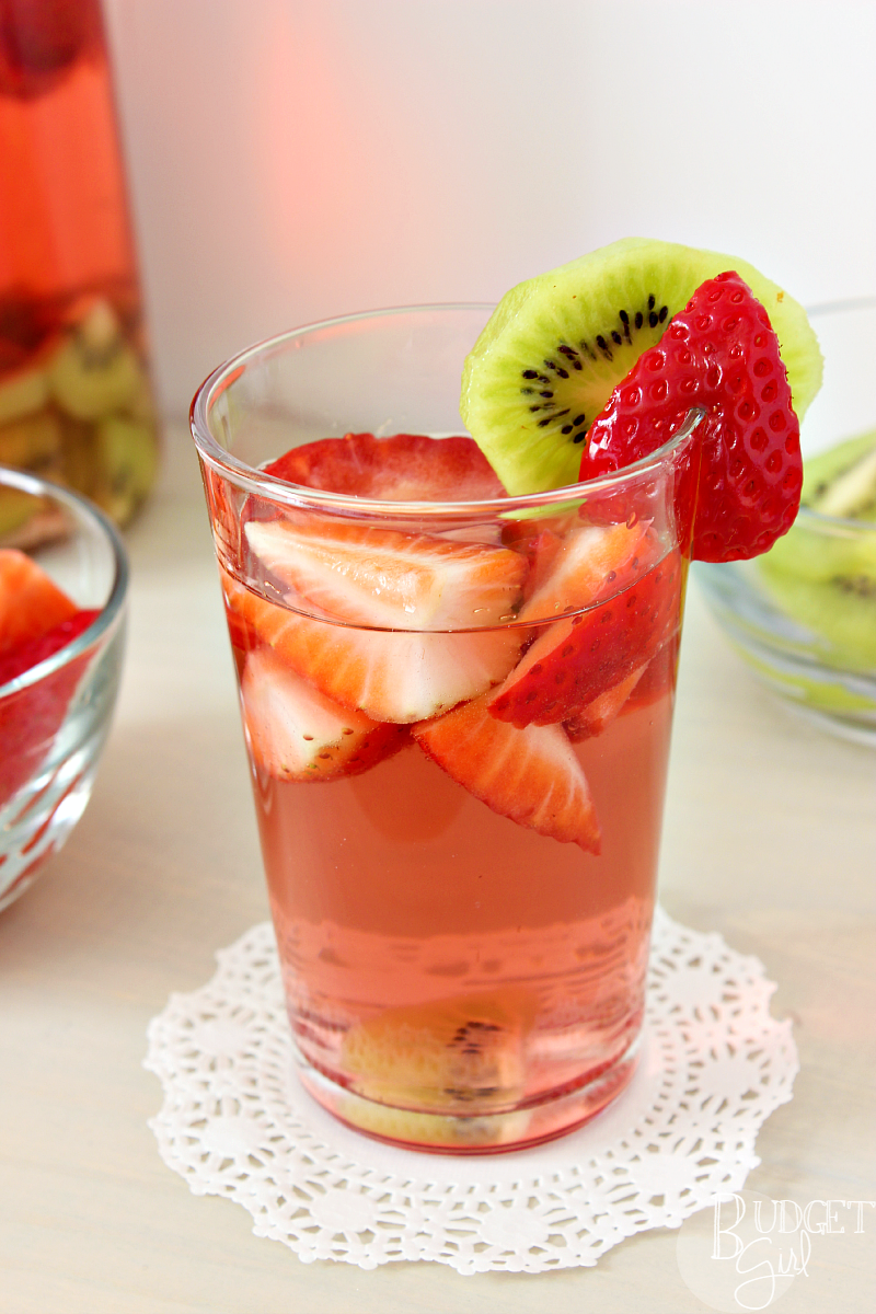 Strawberry Kiwi Sangria is simple to make, pretty to look at, and perfect for both brunch mimosas and summer evenings relaxing on the porch. || via diybudgetgirl.com #sanrgia #wine #strawberry #kiwi #spring #summer #fruit #moscato