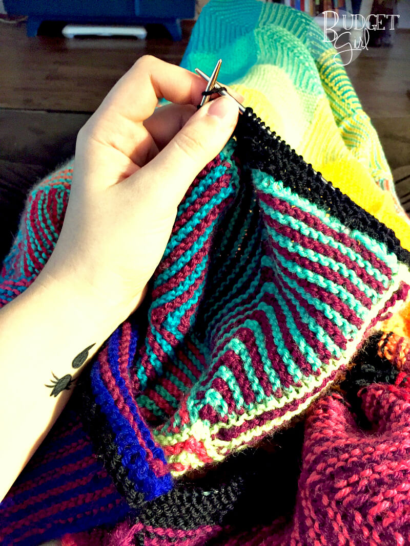 This rainbow hue shift blanket knitting pattern is fun and easy to knit. The resulting blanket is also incredibly soft and heavy. Perfect for cooler months!